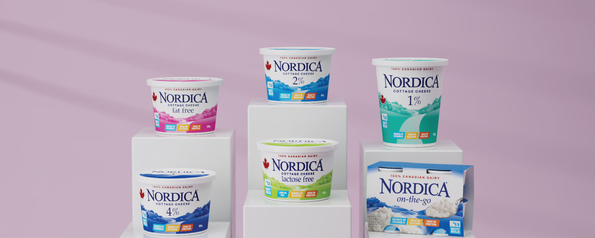 Six Nordica Cottage Cheese products on individual podiums 