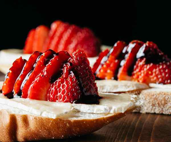 Photo of - Brie Canapes with Pecans on Fruit