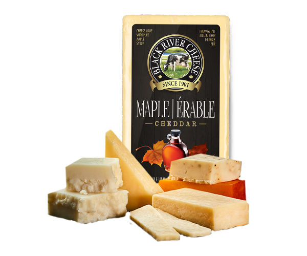 Different kinds of Black River cheese cut together with a BRC  Maple Cheddar package  