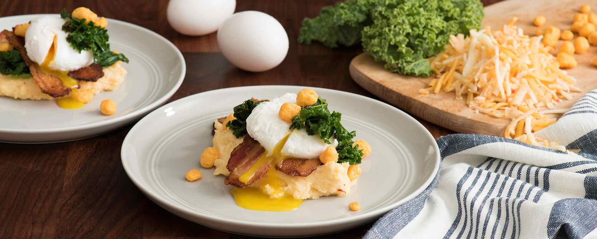 Photo of - Cheesy Grits with Poached Egg, Spicy Greens and Peppered Bacon