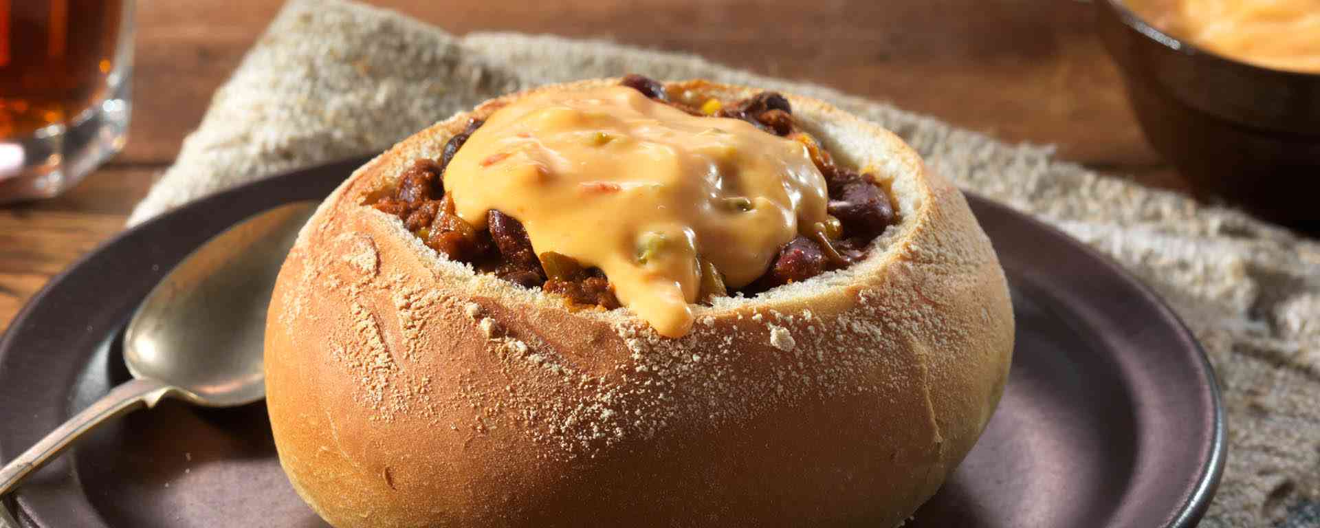 Photo of - Salsa Con Queso Topped Chili in a Bread Bowl