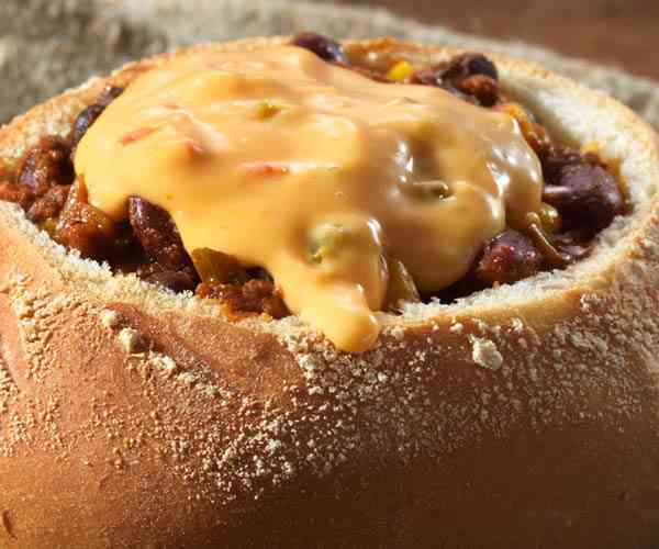 Photo of - Salsa Con Queso Topped Chili in a Bread Bowl